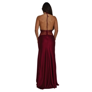 Detail view of burgundy satin dress showing backless cut and intricate lace patchwork