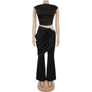 Detail of black two-piece set featuring drawstring waist and asymmetric draped layer pants