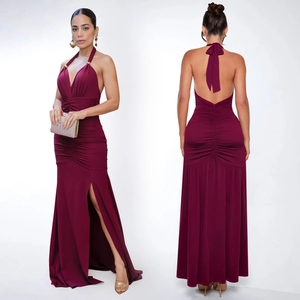 Detail of burgundy V-neck maxi dress featuring ruched design and elegant high side slit
