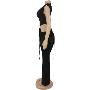 Side view of black crop top and high-waisted pants set with cutout drawstring detail