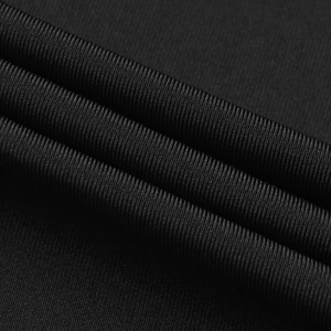 Macro view of high-density black ribbed textile fabric showing refined texture and sheen
