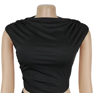 Detailed close-up of a black sleeveless cropped top with draped cowl neck and side ruching