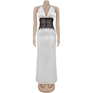 Detail view of the elegant deep V-neckline and black lace patchwork on white satin dress