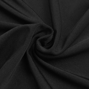 Macro shot of high-elasticity black ribbed knit fabric texture and premium soft material