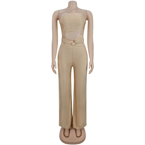 Detail of champagne gold tube jumpsuit with waist cut-out and golden swirl buckle buckle