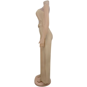 Side view detail of a champagne gold satin strapless jumpsuit with waist metal buckle