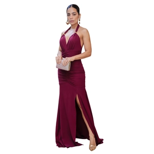 Detail of burgundy halter dress with waist pleats, side slit, and gold ring accents