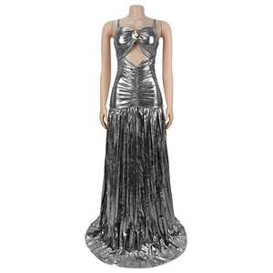 Detail of silver metallic dress featuring front cutout, center ring, and pleated texture
