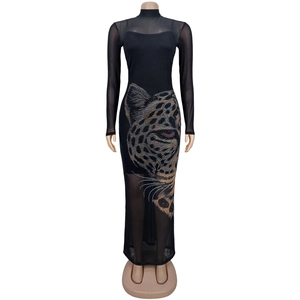 Detail of sheer mesh dress with sparkling rhinestone leopard head and long sleeves