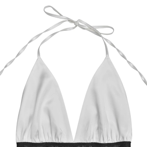 Detail view of white satin halter top with adjustable tie neck and black lace trim border