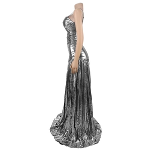 Close-up of metallic silver fabric texture and pleated hem on elegant evening dress