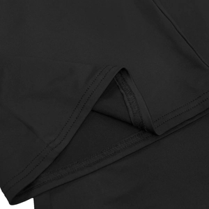 Detailed close-up of high-quality double-needle stitching on black sleeveless crop top set