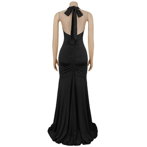 Detail of the oversized back bow and elegant ruching on a black halter evening gown