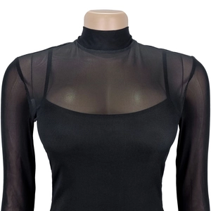 Detail of sheer black mesh mock neck top with fine texture and layered camisole