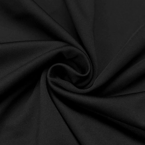 Detail of high-stretch black knitted fabric texture with professional ribbed finish