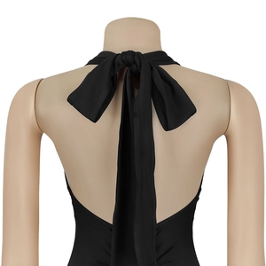 Elegant black halter backless dress featuring a delicate bow tie and open back design