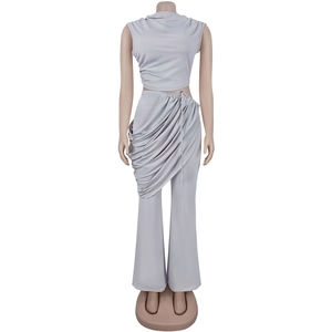 Detail of light grey sleeveless high-neck top and ruched trousers with draped elements