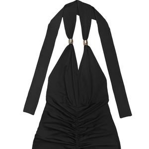 Detail of elegant black V-neck halter dress with gold ring and ruching textures