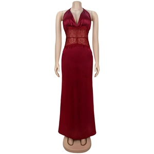 Detailed view of burgundy satin dress with intricate lace patchwork and deep V-neckline