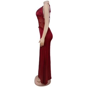 Detail of burgundy satin dress with lace stitching and an elegant open back design