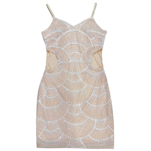 Detail of sequins fan pattern and pearls on champagne mini dress with waist cutouts