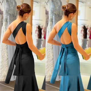 Elegant one-shoulder backless fishtail dress with decorative bow and slim fit design