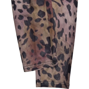 Macro shot of transparent leopard mesh fabric showing double-needle hem stitching detail