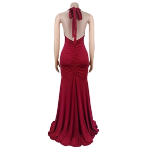 Detailed back view of a burgundy halter dress with elegant ruching and mermaid tail hem