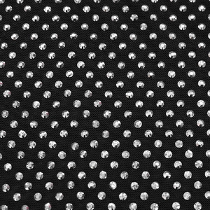 Detail of black mesh fabric with sparkling crystal rhinestones in matrix pattern