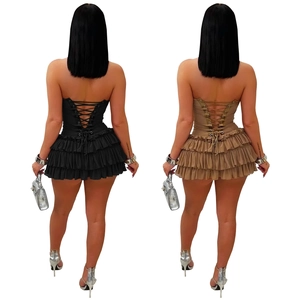 Detail of back lace-up corset design and tiered ruffle hem on mini dresses