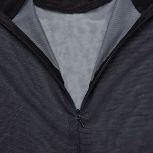Detail shot of the black mesh fabric with a central zipper and breathable grey lining