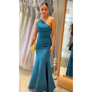 Detail view of navy satin one-shoulder dress with gold metal ring and side pleats
