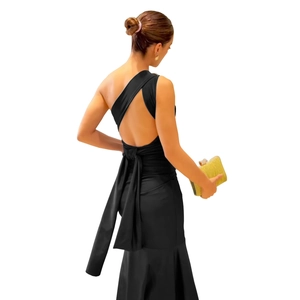 Rear view of elegant black one-shoulder dress with large back bow and mermaid silhouette