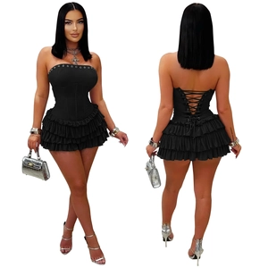 Detail of black strapless mini dress with lace-up back and layered ruffle hemline