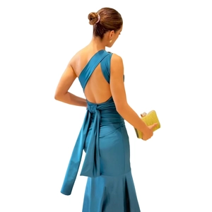 Detail of lake blue mermaid dress featuring elegant backless design and waist bow tie