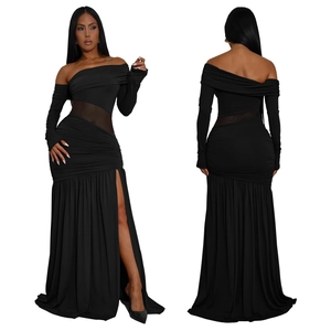 Detail of elegant black off-shoulder long-sleeve dress with sheer mesh and high slit