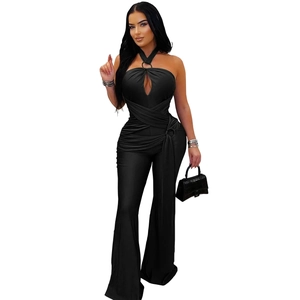 Detail of black halter jumpsuit with teardrop cutout and metal buckle waist decor