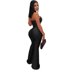 Detail showing the elegant black off-shoulder jumpsuit with flared bell-bottom legs