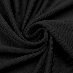 Macro shot of black elastic knit fabric texture with elegant spiral drape and fine weave