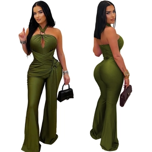 Olive green halter neck jumpsuit featuring metal ring detail and wide leg flared trousers