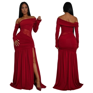 Detail of red off-shoulder maxi dress featuring mesh waist panel and high side slit