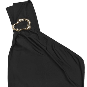 Detail of elegant black one-shoulder dress featuring a decorative gold metallic ring link