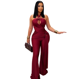 Detail view of burgundy halter neck jumpsuit with waist wrap design and wide leg cut