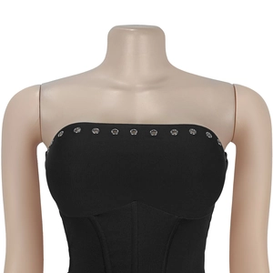 Close-up of black tube top featuring silver metal eyelets and corset style structure