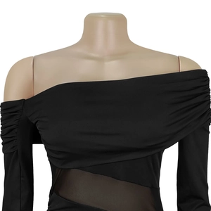 Detail of black off-shoulder dress with mesh splicing and pleated long sleeves
