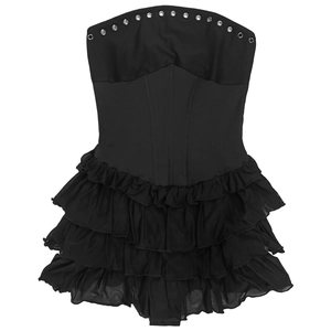 Detail of black strapless corset dress with silver eyelets and tiered mesh ruffles