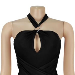 Detail of black halter neck jumpsuit featuring keyhole cutout and silver ring connector