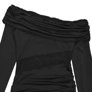 Detail of black off-shoulder dress with ruched fabric and sheer mesh side panels