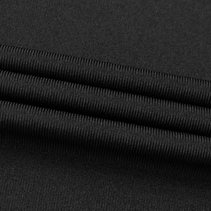 Macro shot of high-density black ribbed knit fabric detail for elegant mermaid dress