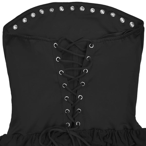Close-up of black strapless mini dress featuring lace-up metal eyelets and mesh ruffles